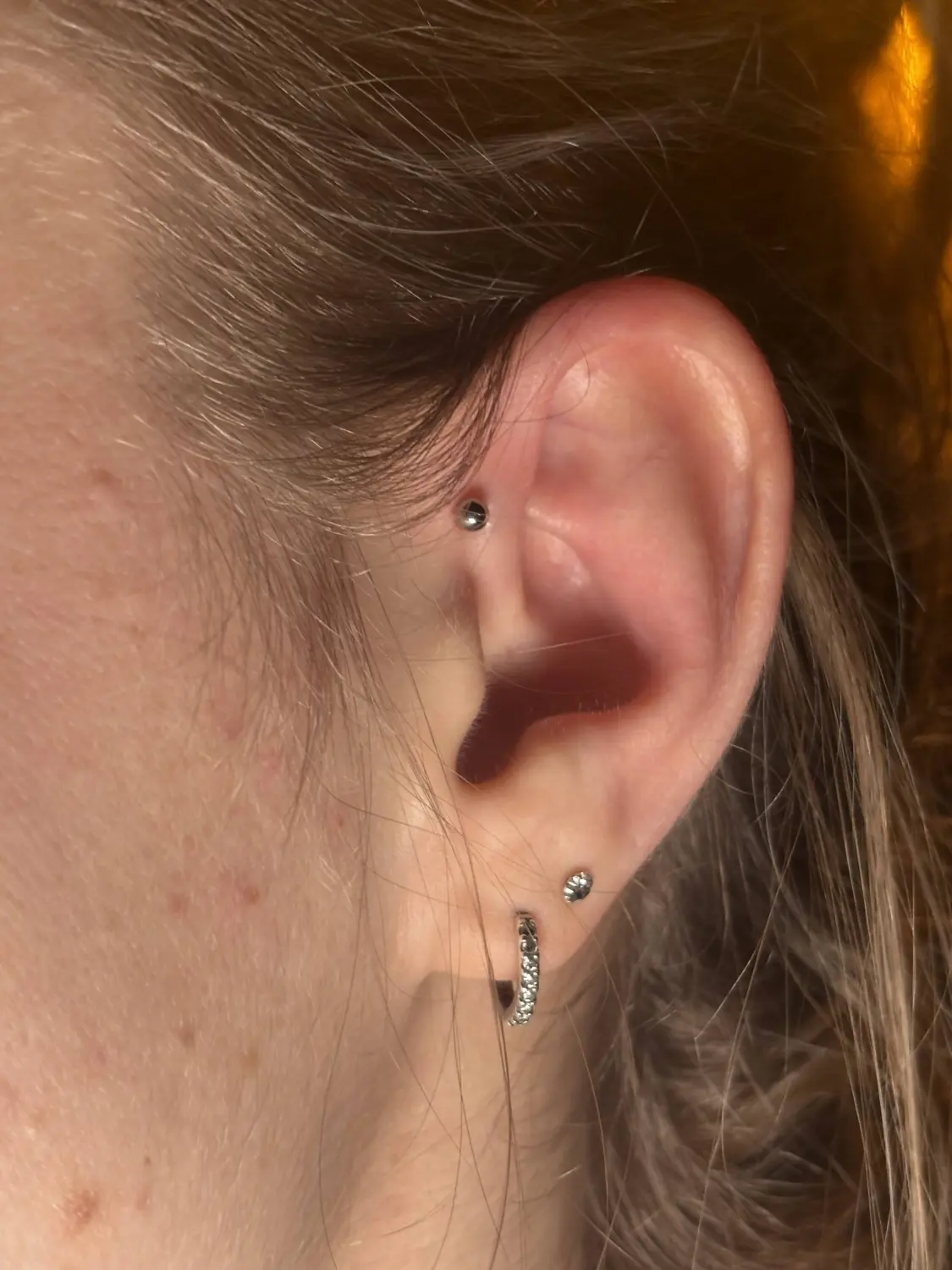 Percing von Stichstelle Tattoo
